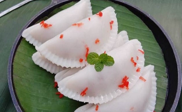 মজাদার তিলের পুলি পিঠা মজাদার তিলের পুলি পিঠা