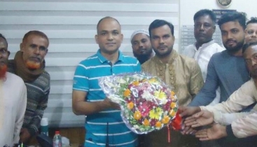 কাহালুর নবাগত ওসি সেলিম রেজাকে ফুলেল শুভেচ্ছা